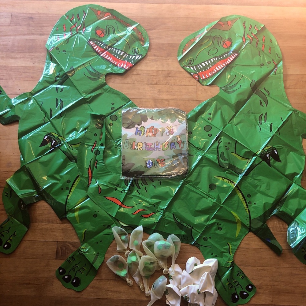 dinosaur first birthday balloons and banner